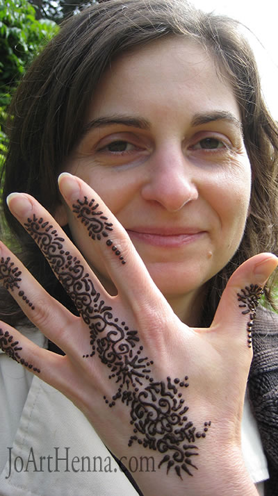 Edina showing off the unique henna hand design